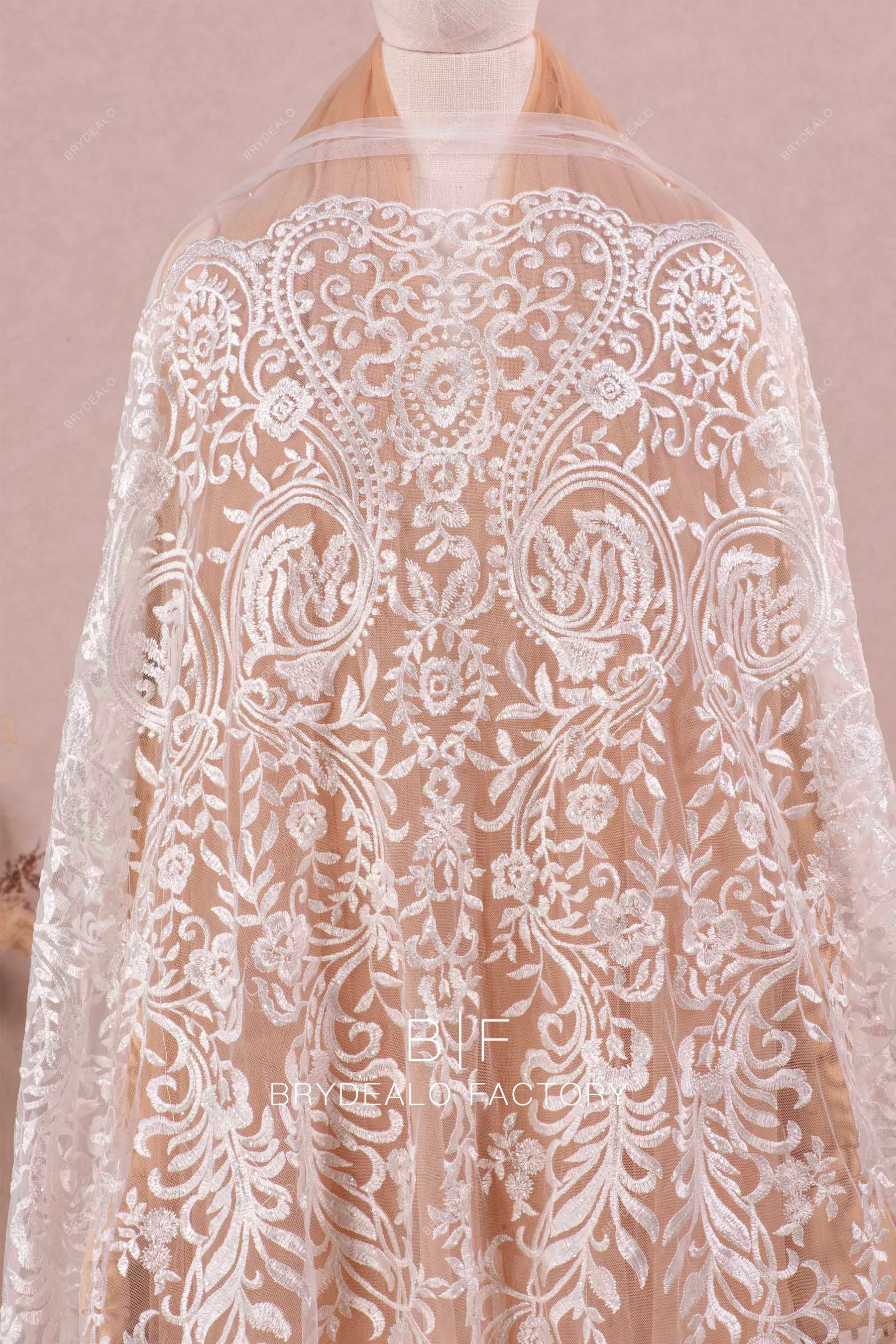 Designer Shimmer Totem Motif Embroidered Lace Online